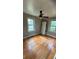 Bright bedroom with natural light, hardwood floors, and a modern ceiling fan at 5030 Beach Ct, Denver, CO 80221