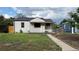 Charming one-story home with a well-maintained lawn and an inviting front porch at 5030 Beach Ct, Denver, CO 80221
