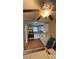 Traditional kitchen with white cabinets, white countertops, tile floors, and a ceiling fan at 5030 Beach Ct, Denver, CO 80221