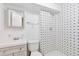 Basement bathroom with shower and patterned tile at 9105 Oberon Rd # 2, Arvada, CO 80004