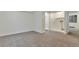 Spacious finished basement bedroom with neutral carpeting and ample closet space at 9105 Oberon Rd # 2, Arvada, CO 80004