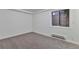 Bright finished basement bedroom featuring neutral walls and carpeting at 9105 Oberon Rd # 2, Arvada, CO 80004