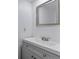 Modern bathroom with gray vanity and a large mirror at 9105 Oberon Rd # 2, Arvada, CO 80004