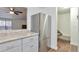 Stainless steel refrigerator and gray cabinets in updated kitchen at 9105 Oberon Rd # 2, Arvada, CO 80004