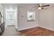 Bright living room with wood-look floors and kitchen pass-through at 9105 Oberon Rd # 2, Arvada, CO 80004