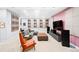 Basement living room area featuring a comfortable sofa, TV, and soundproofing panels on the walls at 4491 Shoshone Dr, Larkspur, CO 80118