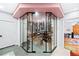 Glass enclosed wine cellar with ample storage racks for wine bottle display and temperature control at 4491 Shoshone Dr, Larkspur, CO 80118