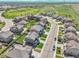 Aerial shot displaying a neighborhood street with well-maintained lawns and sidewalks at 7888 E 139Th Pl, Brighton, CO 80602