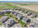 Wide aerial shot of the area with many homes including solar panels and well maintained lawns at 7888 E 139Th Pl, Brighton, CO 80602