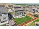 Aerial view of a landscaped backyard featuring a lush lawn, patio with furniture, and wooden fence for privacy at 7888 E 139Th Pl, Brighton, CO 80602