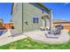 Stamped concrete patio with outdoor seating perfect for entertaining and grilling in a fenced yard at 7888 E 139Th Pl, Brighton, CO 80602
