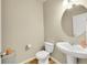 Half bathroom with white toilet and pedestal sink at 7888 E 139Th Pl, Brighton, CO 80602