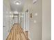 Inviting hallway featuring modern flooring, white doors, and neutral wall colors with ample natural light at 7888 E 139Th Pl, Brighton, CO 80602