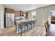 Modern kitchen featuring stainless steel appliances, a central island with bar seating, and abundant storage space at 7888 E 139Th Pl, Brighton, CO 80602