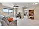 Carpeted sitting area with bookshelves and window at 7888 E 139Th Pl, Brighton, CO 80602