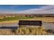 Community with views of the surrounding neighborhood, park and green spaces from a hilltop bench at 7888 E 139Th Pl, Brighton, CO 80602