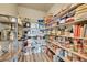 Well-stocked pantry with ample shelving and a variety of food and household items at 7888 E 139Th Pl, Brighton, CO 80602