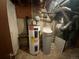 Unfinished basement with water heater, water softener, and HVAC unit at 191 S Dearborn Cir, Aurora, CO 80012