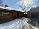 Exterior view of the home showing the entrance and driveway at 191 S Dearborn Cir, Aurora, CO 80012