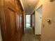 Long hallway with multiple doors and carpet flooring at 191 S Dearborn Cir, Aurora, CO 80012