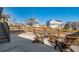 Backyard features a patio seating area with Adirondack chairs, perfect for outdoor relaxation and socializing at 1087 E Hopkins Dr, Elizabeth, CO 80107