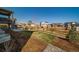 View of the backyard including an outdoor seating area and wooden fence surrounding the perimeter at 1087 E Hopkins Dr, Elizabeth, CO 80107