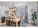 Comfortable dining room featuring modern lighting, stylish decor, and a plant at 1087 E Hopkins Dr, Elizabeth, CO 80107