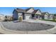 Attractive home featuring a three car garage and a well manicured front yard at 1087 E Hopkins Dr, Elizabeth, CO 80107