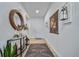 Inviting foyer featuring light wood floors, stylish decor, and bright white walls at 1087 E Hopkins Dr, Elizabeth, CO 80107