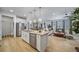 Open-concept kitchen with large island, stainless appliances and views to the Gathering room at 1087 E Hopkins Dr, Elizabeth, CO 80107