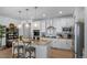 Gourmet kitchen includes an island with bar seating and stainless appliances at 1087 E Hopkins Dr, Elizabeth, CO 80107