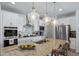 Bright kitchen with granite counters, stainless appliances, and pendant lighting at 1087 E Hopkins Dr, Elizabeth, CO 80107