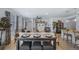 Open living space featuring stylish decor, neutral colors, and a view into the kitchen at 1087 E Hopkins Dr, Elizabeth, CO 80107