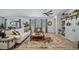 Inviting living room with large windows, stylish decor, and custom built-ins at 1087 E Hopkins Dr, Elizabeth, CO 80107