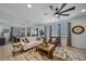 Comfortable living room with patterned rug, plush seating, and natural light at 1087 E Hopkins Dr, Elizabeth, CO 80107