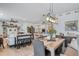 Open concept living space featuring a dining area, kitchen, and living room at 1087 E Hopkins Dr, Elizabeth, CO 80107