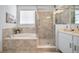 The main bathroom features a large tub and a separate shower, and neutral-colored tile at 1087 E Hopkins Dr, Elizabeth, CO 80107