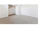 Neutral carpeted living room with fresh paint and staircase in view at 6804 Merseyside Ln, Castle Pines, CO 80108