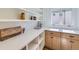 Spacious pantry with ample shelving, white countertops, and custom cabinets at 2395 High Lonesome Trl, Lafayette, CO 80026