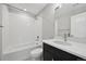 Bright bathroom featuring white subway tiles in the shower and a dark vanity at 5905 S Platte Canyon Dr, Littleton, CO 80123