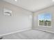 Bright bedroom featuring plush carpeting, neutral walls, recessed lighting, and great windows at 5905 S Platte Canyon Dr, Littleton, CO 80123