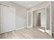Bright bedroom with wood floors, closet and glass door at 5905 S Platte Canyon Dr, Littleton, CO 80123