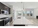 Modern kitchen with stainless steel appliances, quartz countertops, and views at 5905 S Platte Canyon Dr, Littleton, CO 80123