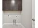 Neutral laundry room at 5905 S Platte Canyon Dr, Littleton, CO 80123