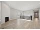 Spacious living room with hardwood floors, recessed lighting, and a sleek fireplace at 5905 S Platte Canyon Dr, Littleton, CO 80123
