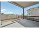 Covered patio with concrete flooring, stone wall, and backyard access at 5905 S Platte Canyon Dr, Littleton, CO 80123