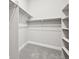 Bright walk-in closet with custom shelving and plenty of storage space for clothes and accessories at 5905 S Platte Canyon Dr, Littleton, CO 80123