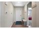 Bright foyer with a coat rack and a bench; the front door lets in ample light and creates a welcoming space at 26909 E Cedar Ave, Aurora, CO 80018