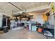 Organized garage with ample storage space, shelving units, and a clean, well-maintained concrete floor at 26909 E Cedar Ave, Aurora, CO 80018