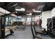 Gym features updated equipment and a mirrored wall at 26909 E Cedar Ave, Aurora, CO 80018